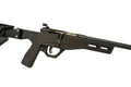 A black tactical rifle with a mounted scope, displayed horizontally on a white surface against a white background.
