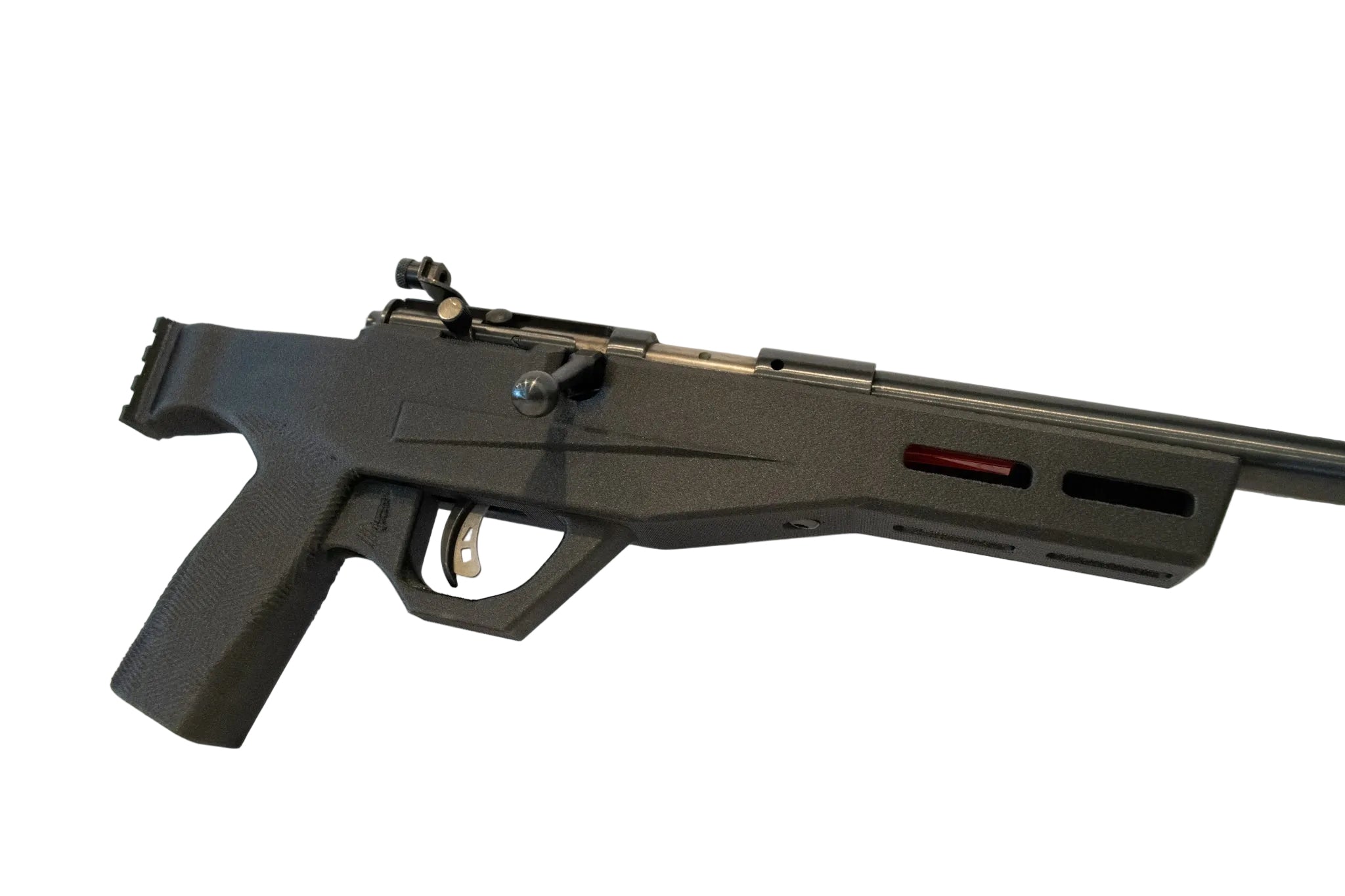 A black tactical-style rifle or airsoft gun with a mounted scope and a red accent on the receiver, displayed on a white surface against a white background.