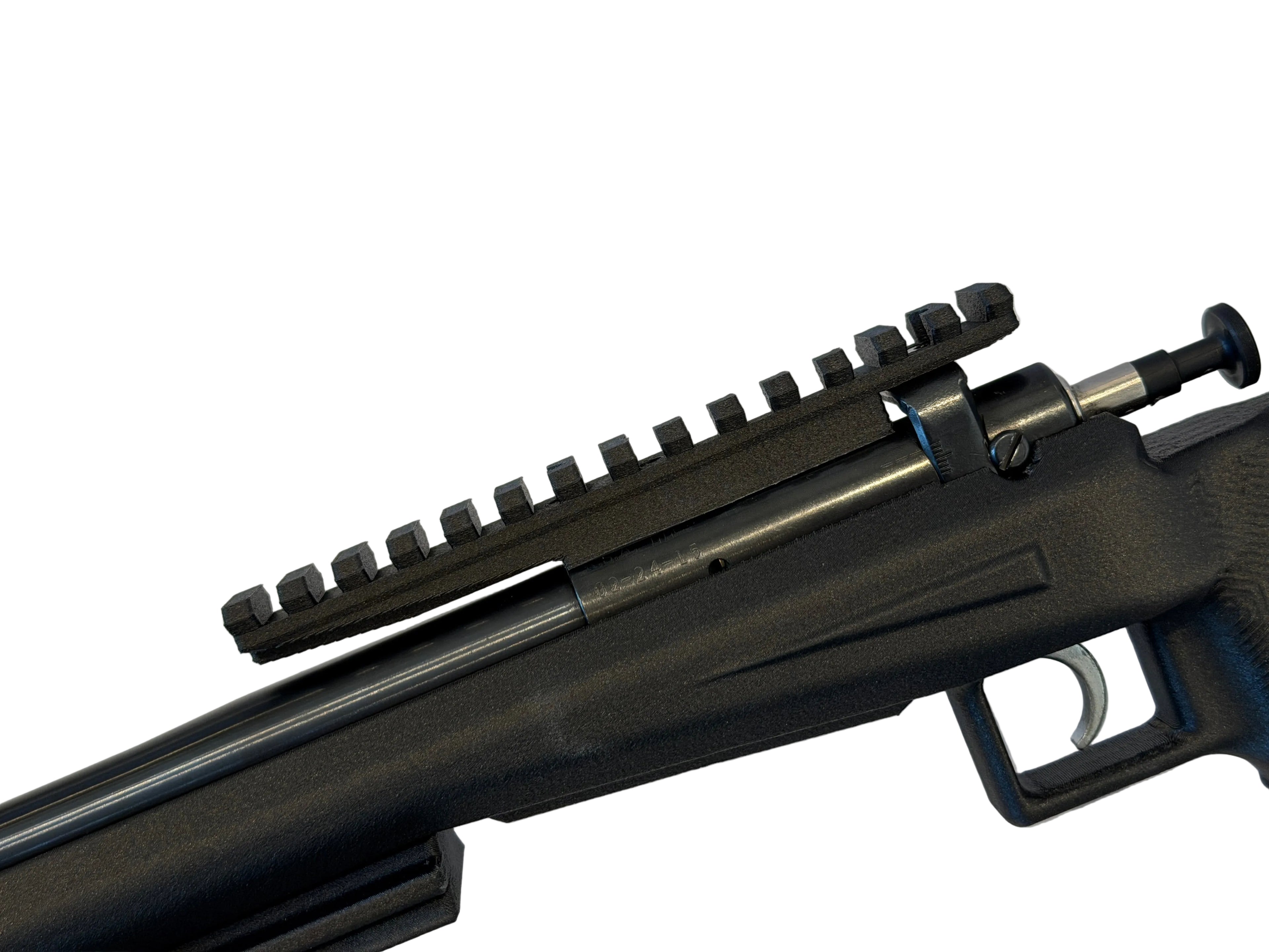 Close-up of a black rifle on a white background