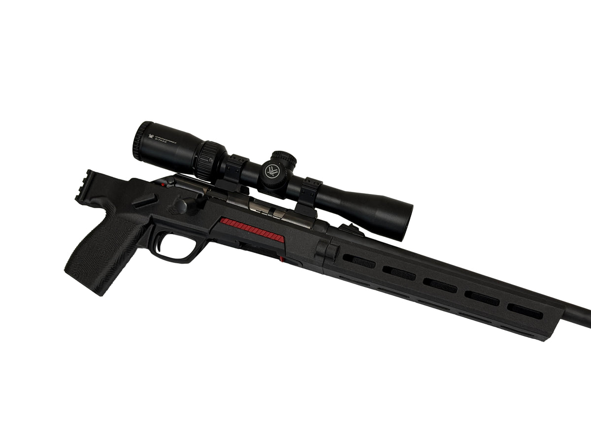 A black tactical bolt-action rifle with an attached scope, featuring a red accent stripe on the receiver, shown against a plain white background.
